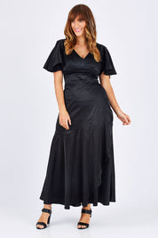 Model Laura wearing size 12 of the Fleur Dress in colour Black (Black), from the front, showing the whole outfit