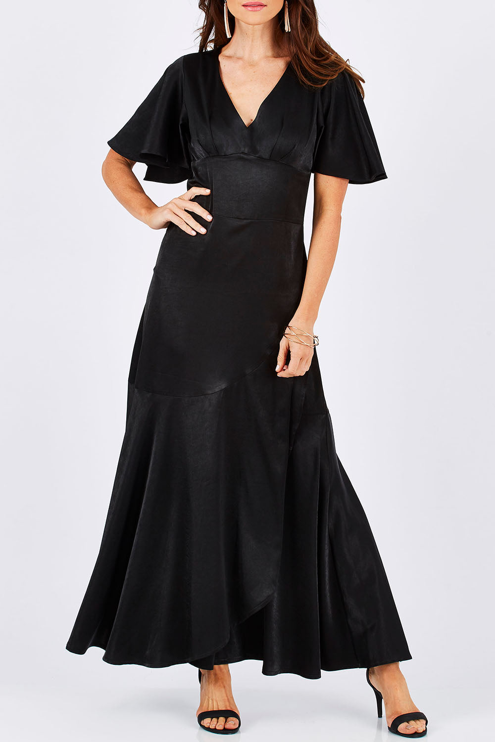 Model Monique wearing size 8 of the Fleur Dress in colour Black (Black), from the front, cropped image