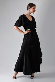 Model Monique wearing size 8 of the Fleur Dress in colour Black (Black), from the front, showing the whole outfit