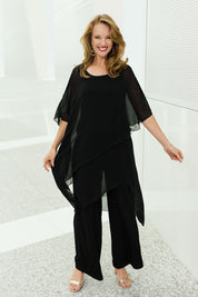 Model Katie wearing size 10 of the Sandra Jumpsuit in colour Black (Black), from the front, showing the whole outfit