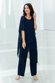 Model Andrea wearing size 10 of the Sandra Jumpsuit in colour Navy (Blue), from the front, showing the whole outfit