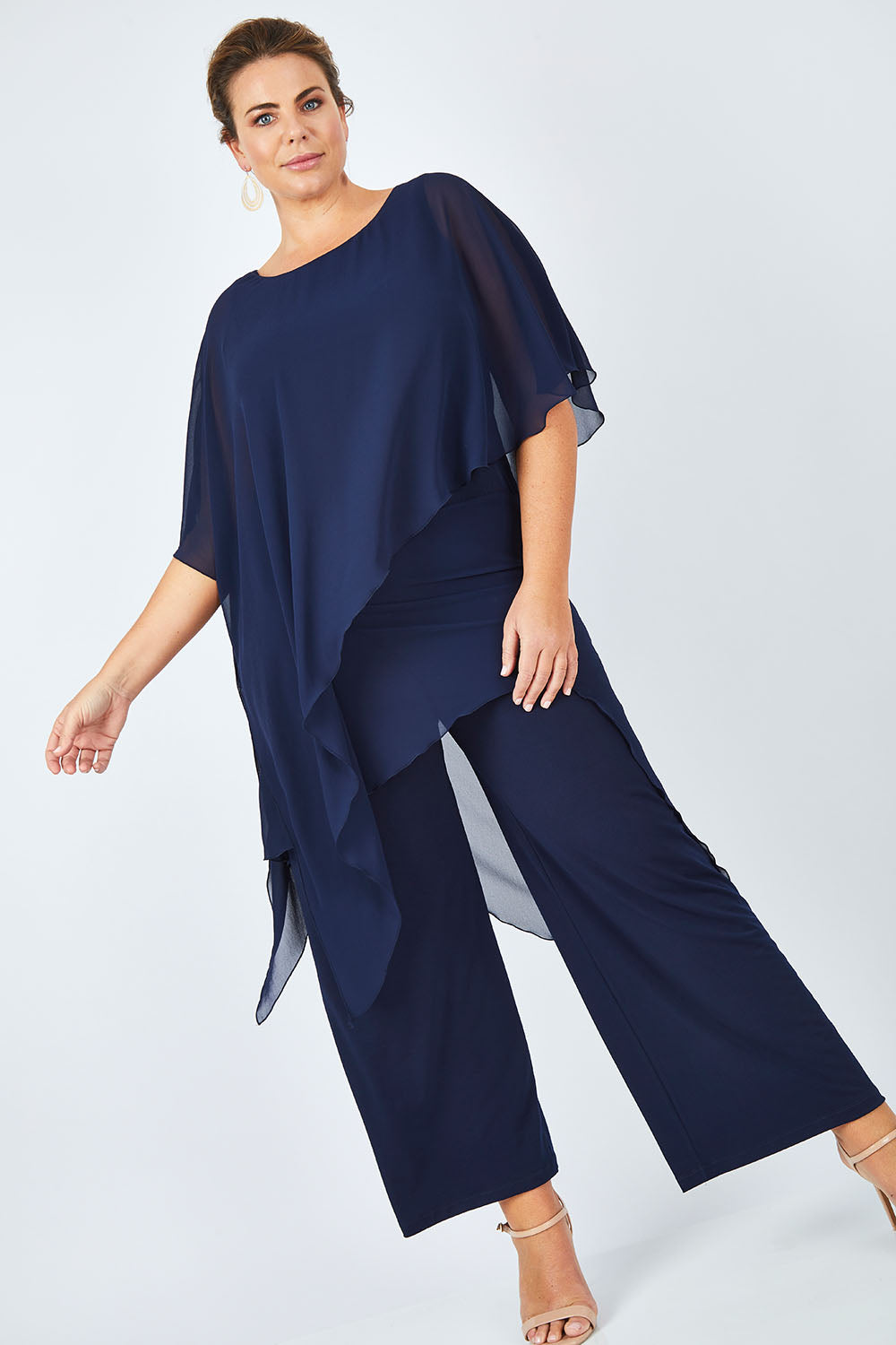 Model Fiona wearing size 16 of the Sandra Jumpsuit in colour Navy (Blue), from the front, showing the whole outfit