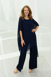 Model Katie wearing size 10 of the Sandra Jumpsuit in colour Navy (Blue), from the front, showing the whole outfit