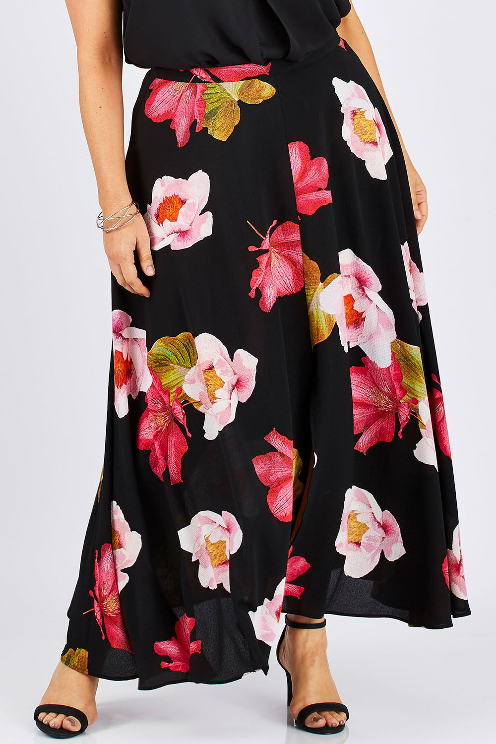 Model Ljubenka wearing size 18 of the Hannah Skirt in colour Goddess (Black), from the front, cropped image