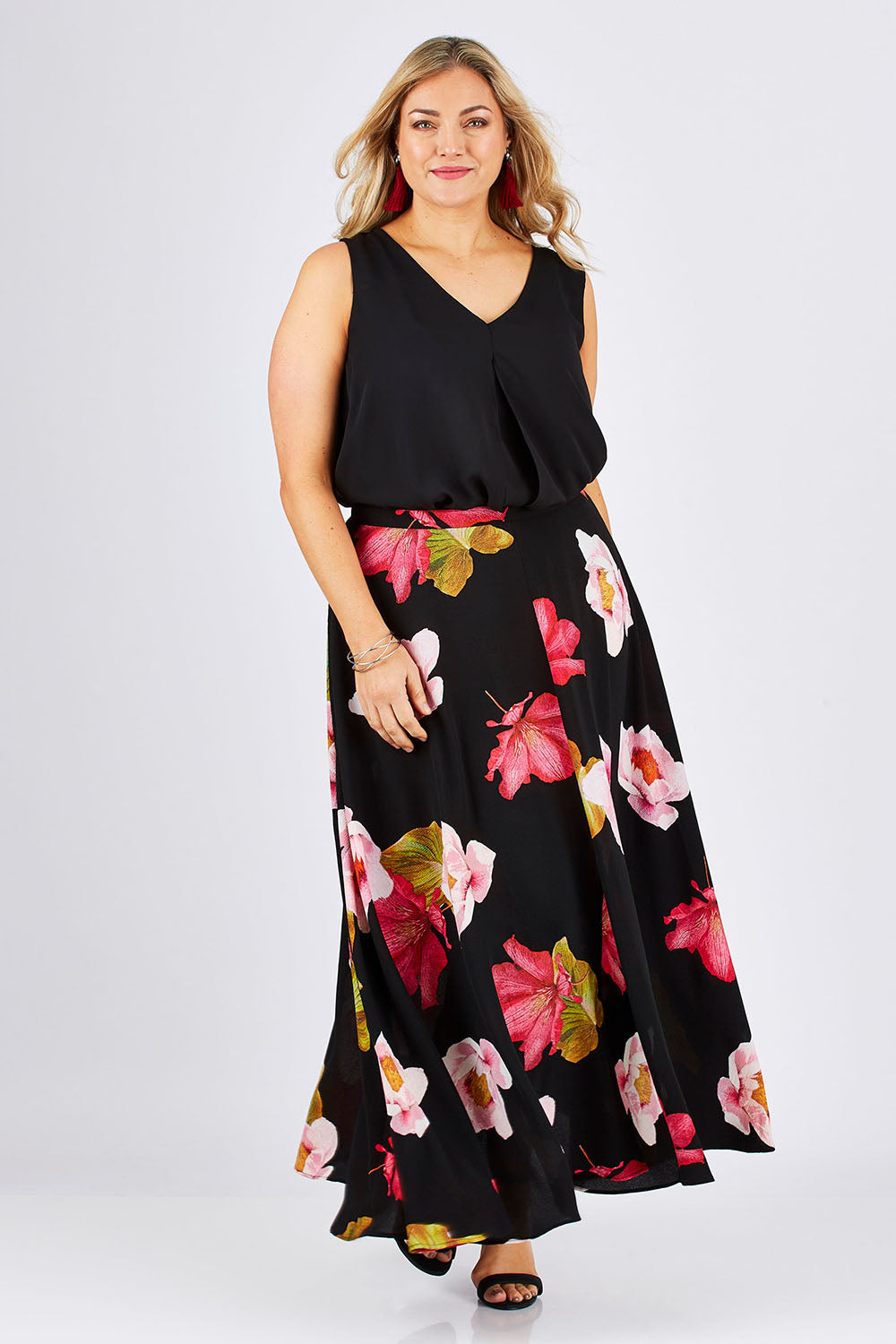 Model Ljubenka wearing size 18 of the Hannah Skirt in colour Goddess (Black), from the front, showing the whole outfit