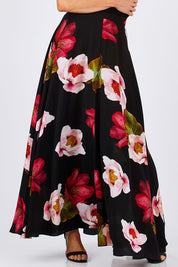 Model Monique wearing size 8 of the Hannah Skirt in colour Goddess (Black), from the front, cropped image