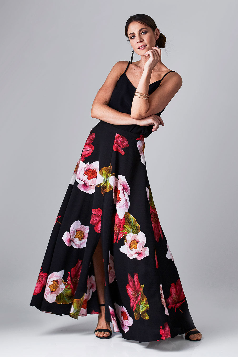 Model Monique wearing size 8 of the Hannah Skirt in colour Goddess (Black), from the front, showing the whole outfit