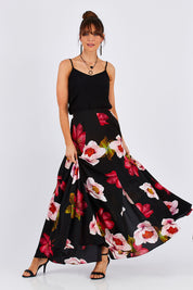 Model Monique wearing size 8 of the Hannah Skirt in colour Goddess (Black), from the front, showing the whole outfit