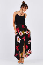 Model Monique wearing size 8 of the Hannah Skirt in colour Goddess (Black), from the front, showing the whole outfit