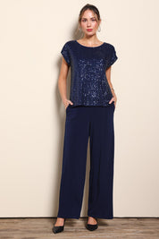 Model Maddiec wearing size 10 of the Kristi Pants - Navy in colour Navy, from the front