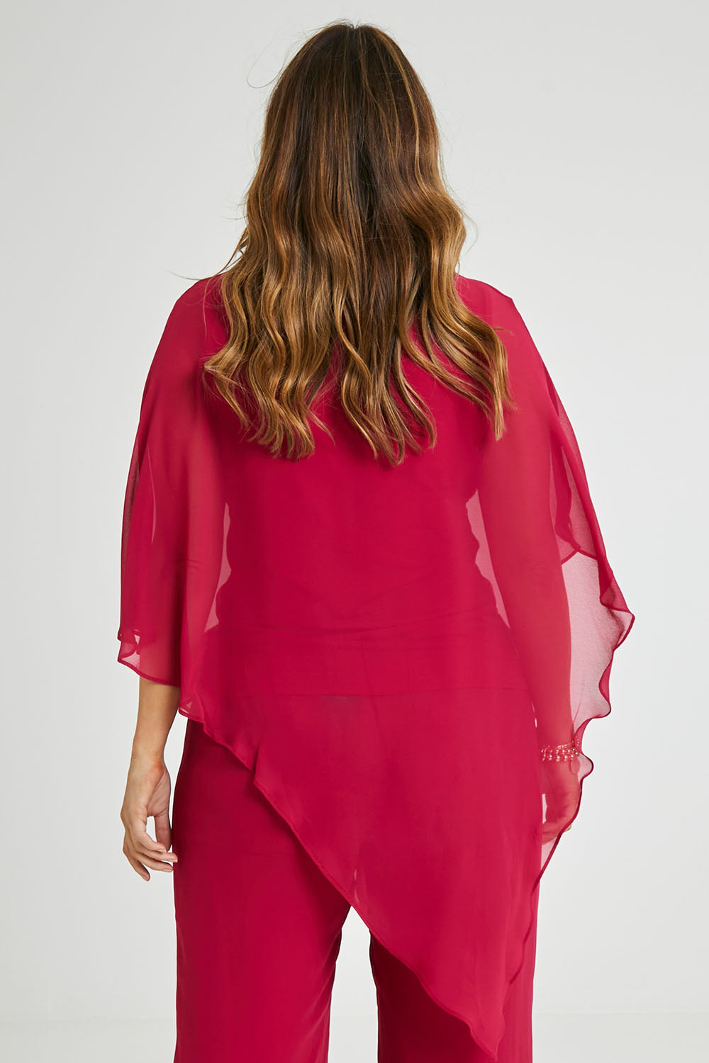 Model Laura wearing size 14 of the Marie Top in colour Granita (Pink), from the back