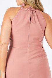 Model Fiona wearing size 16 of the Adriana Dress in colour Camelia (Pink), from the back