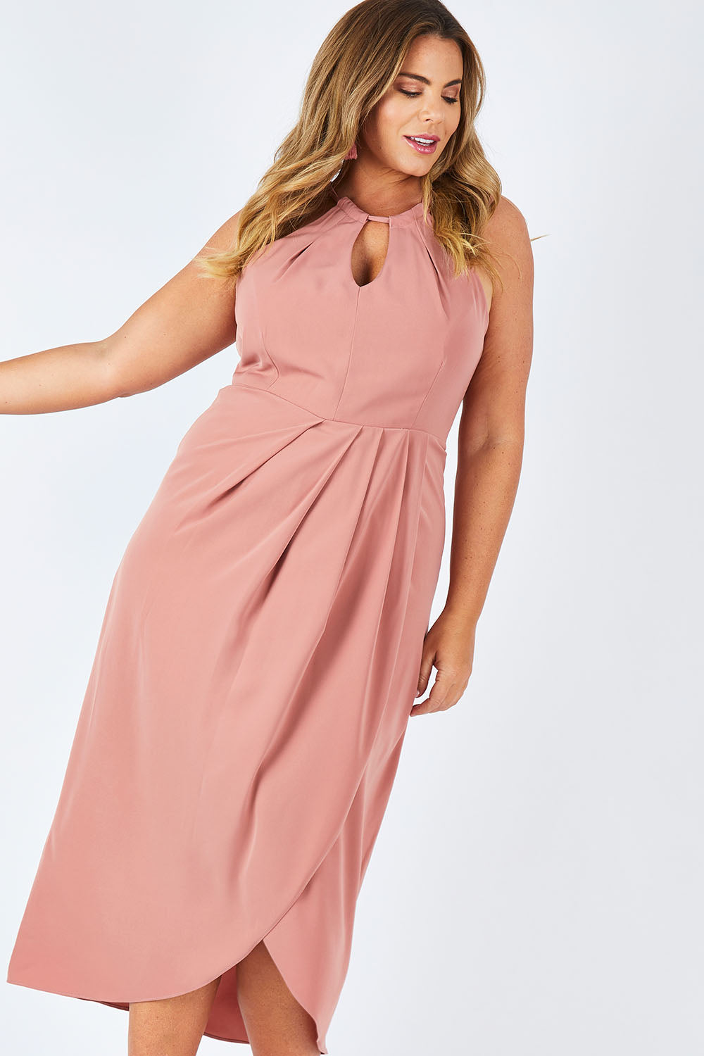 Model Fiona wearing size 16 of the Adriana Dress in colour Camelia (Pink), from the front, cropped image