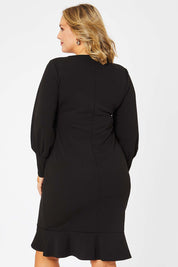 Model Jess wearing size 14 of the Sophie Dress in colour Black (Black), from the back