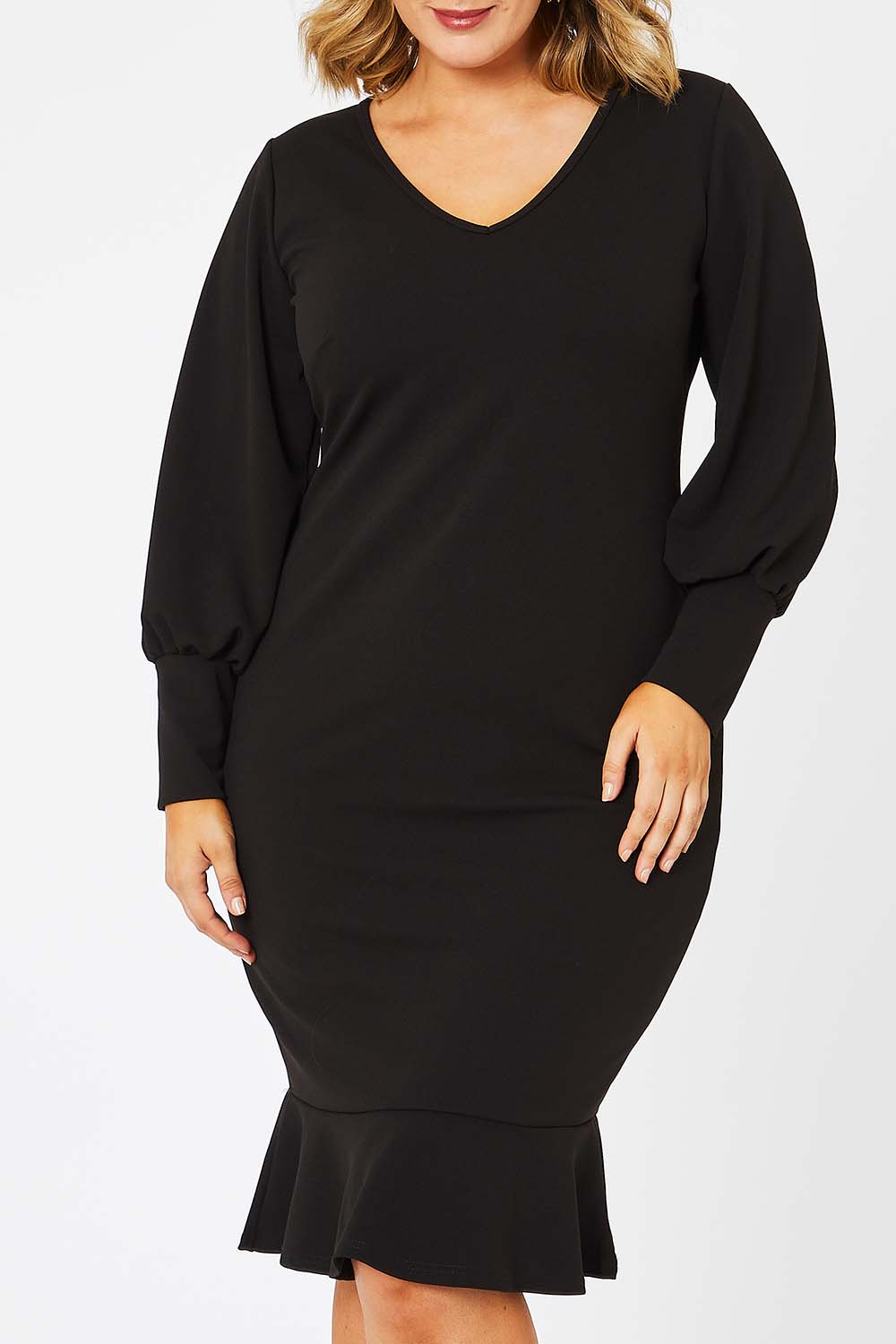 Model Jess wearing size 14 of the Sophie Dress in colour Black (Black), from the front, cropped image