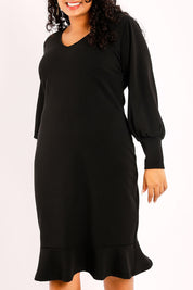 Model Sasha-Lee wearing size 16 of the Sophie Dress in colour Black (Black), from the front, cropped image