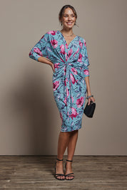 Model Madeline wearing size 10 of The Printed Nancy Dress in colour Windflower, from the front, showing the whole outfit