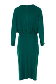 Product shot of the Nancy Dress in colour Forest (Green), from the back