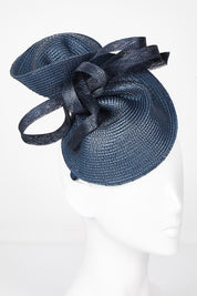 A model wearing size OneSize of the Drew Fascinator in colour Navy (Blue), from the front, showing the whole outfit