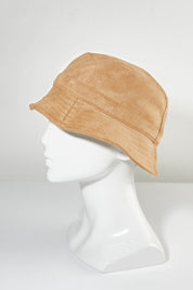 A model wearing the Nina Bucket Hat in colour Camel, from the front, showing the whole outfit