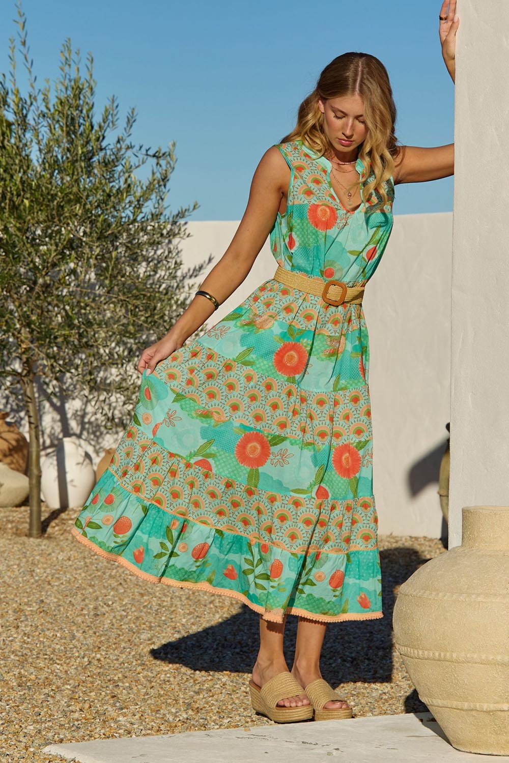 A model wearing the Lulu Cotton Maxi Dress in colour Sunny (Green), from the front, showing the whole outfit