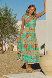 A model wearing the Lulu Cotton Maxi Dress in colour Sunny (Green), from the front, showing the whole outfit