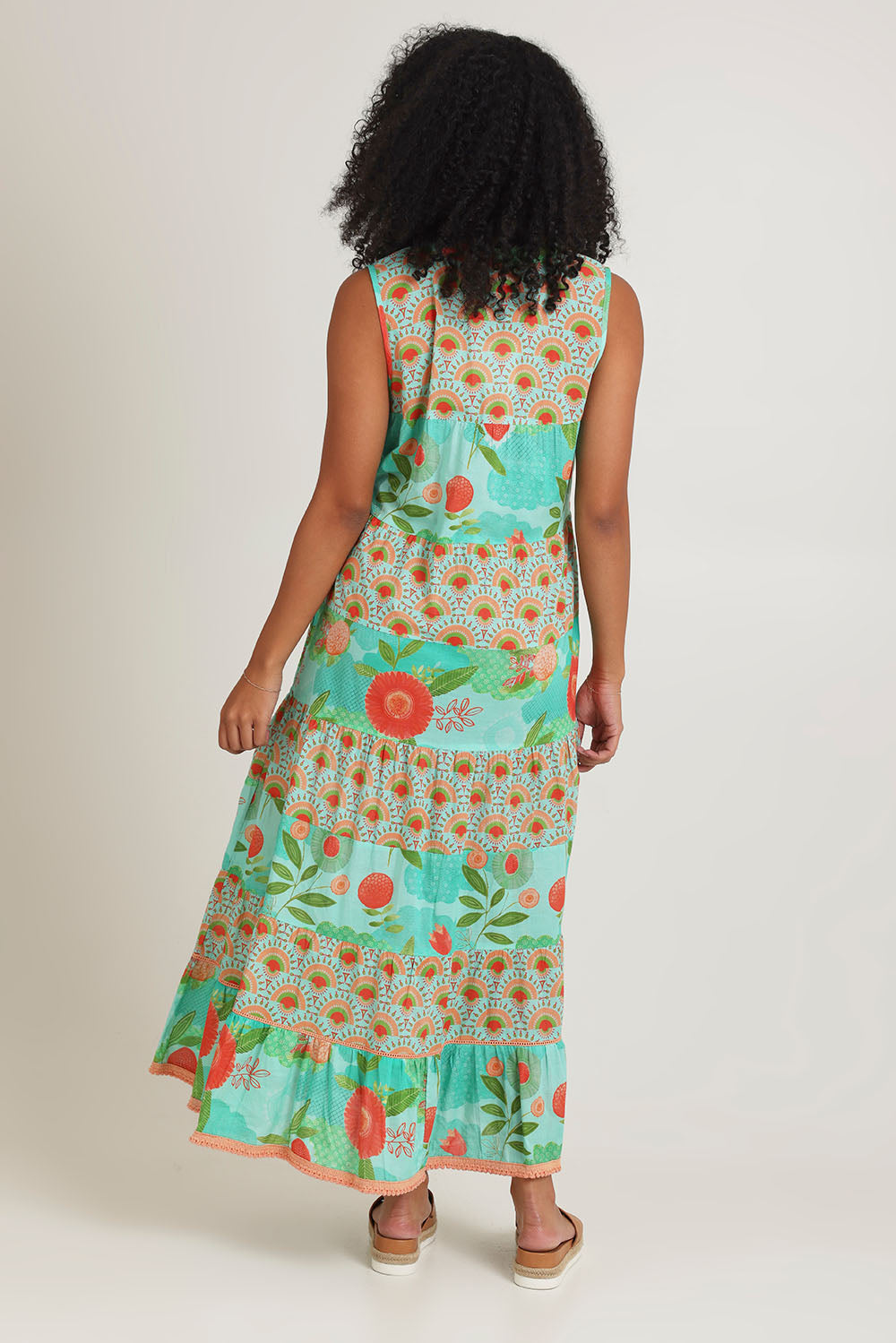 Model Ziara wearing size S of the Lulu Cotton Maxi Dress in colour Sunny (Green), from the back