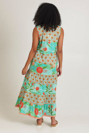 Model Ziara wearing size S of the Lulu Cotton Maxi Dress in colour Sunny (Green), from the back
