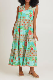 Model Ziara wearing size S of the Lulu Cotton Maxi Dress in colour Sunny (Green), from the front, cropped image