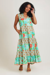 Model Ziara wearing size S of the Lulu Cotton Maxi Dress in colour Sunny (Green), from the front, showing the whole outfit