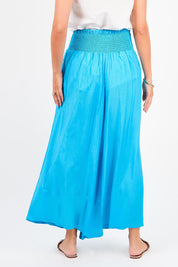 A model wearing the Hendrix Pant in colour Turquoise (Blue), from the back