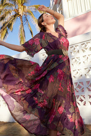A model wearing the Amisha Short Sleeve Maxi Dress in colour Waterlily (Blue), from the front, showing the whole outfit