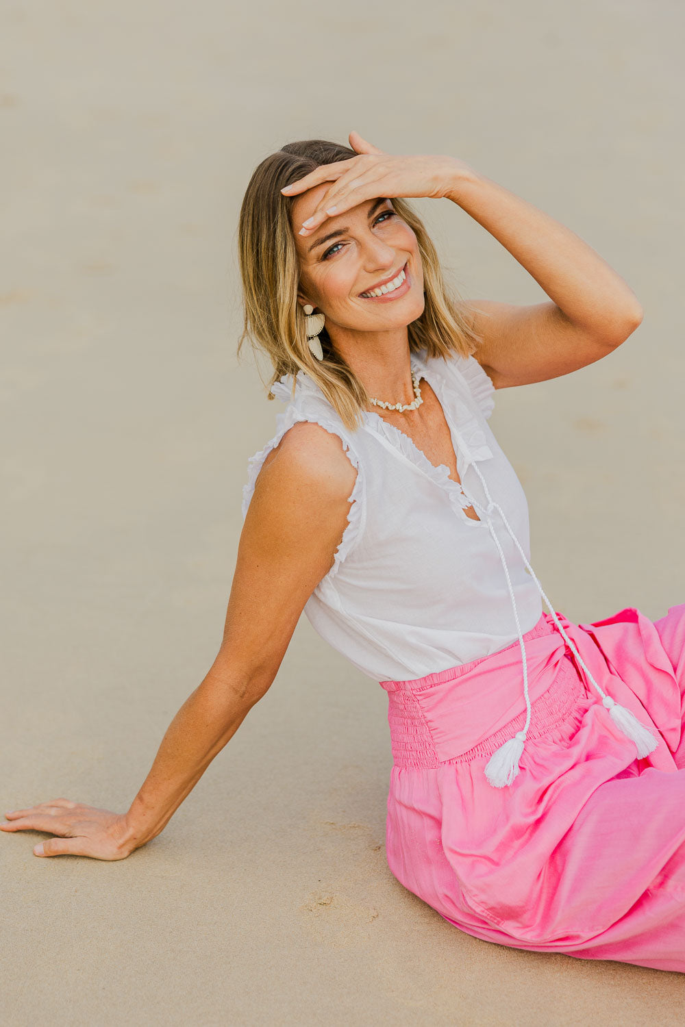 Model Riina wearing size S of the Sophia Cami in colour White (White), from the front, showing the whole outfit