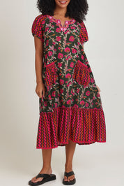 Model Ziara wearing size S of the Sao Paulo Cotton Midi Dress in colour Jewel (Green), from the front, cropped image
