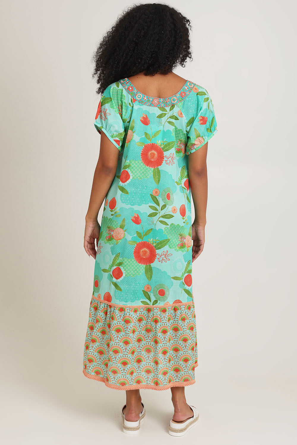 Model Ziara wearing size S of the Sao Paulo Cotton Midi Dress in colour Sunny (Green), from the front, cropped image