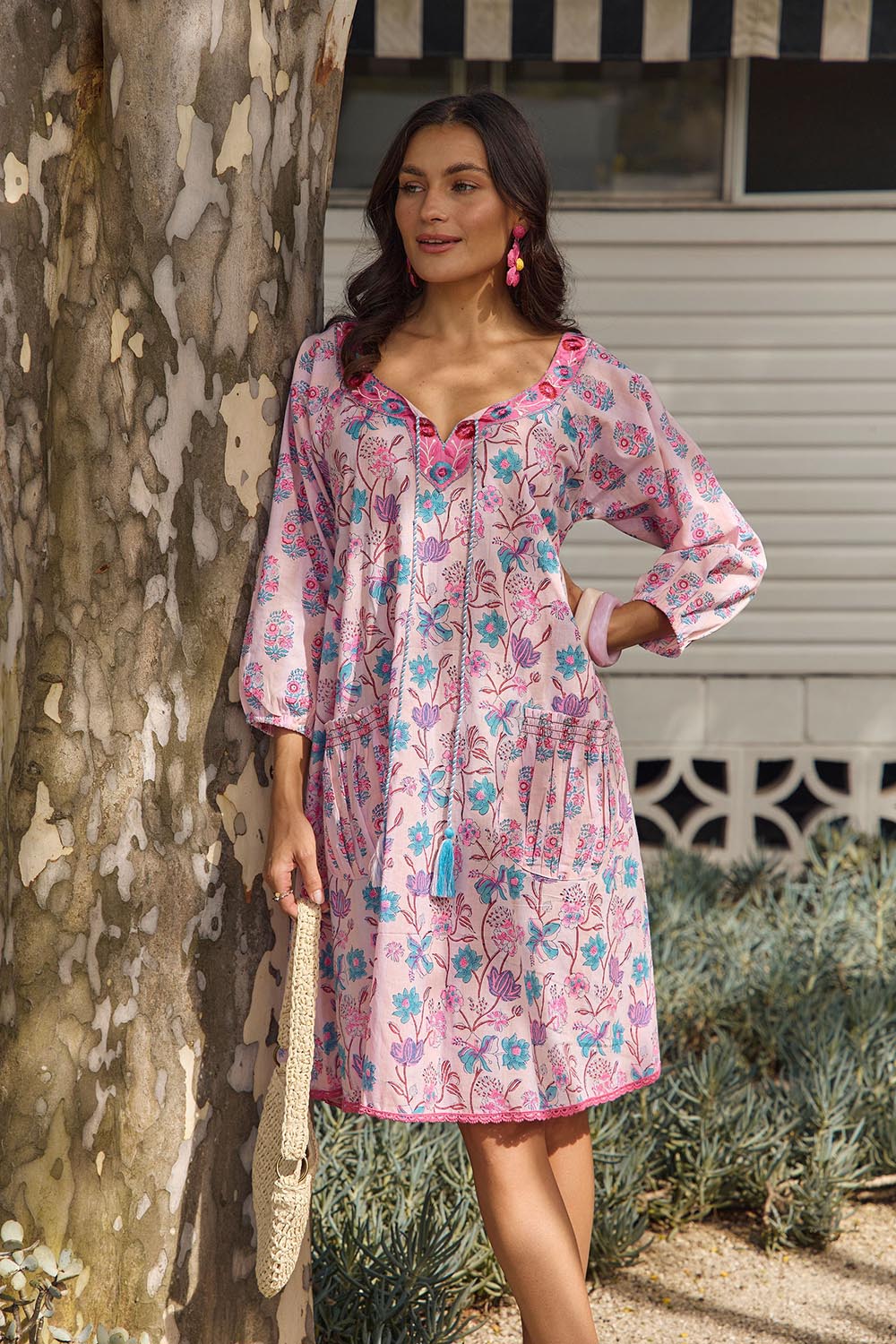 Model Genericm wearing size sample of the Sao Paulo Cotton Dress – Cupcake in colour Cupcake, from an angle