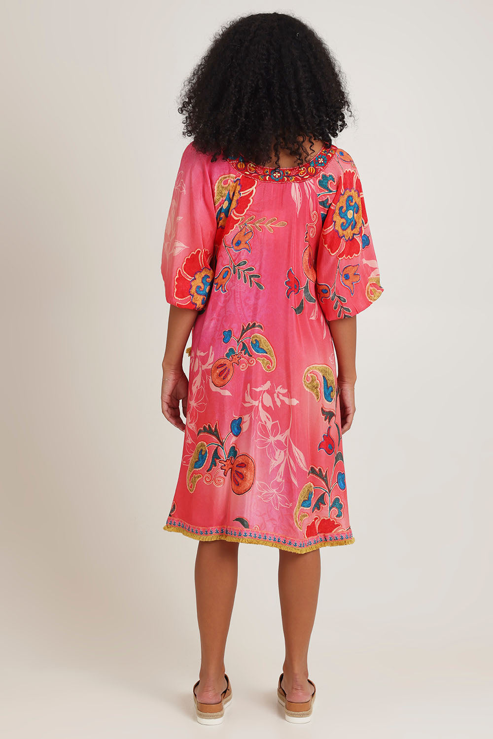 Model Ziara wearing size S of the Sao Paulo Long Sleeve Dress in colour Gloria (Pink), from the back