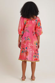 Model Ziara wearing size S of the Sao Paulo Long Sleeve Dress in colour Gloria (Pink), from the back