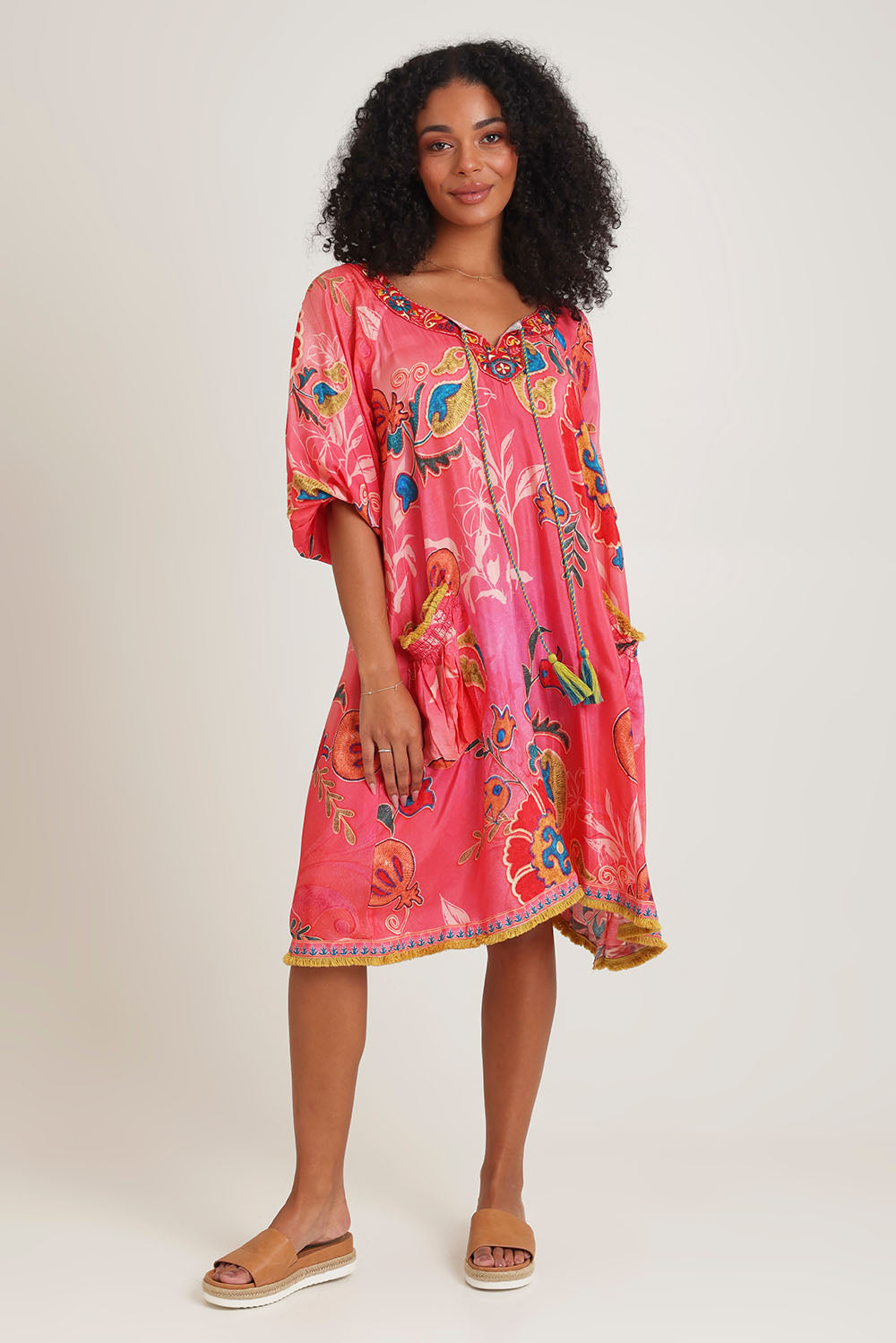 Model Ziara wearing size S of the Sao Paulo Long Sleeve Dress in colour Gloria (Pink), from the front, showing the whole outfit