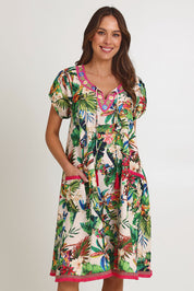 Model Madeline wearing size S of the Sao Paulo Cotton Dress in colour Maui, from the front, cropped image