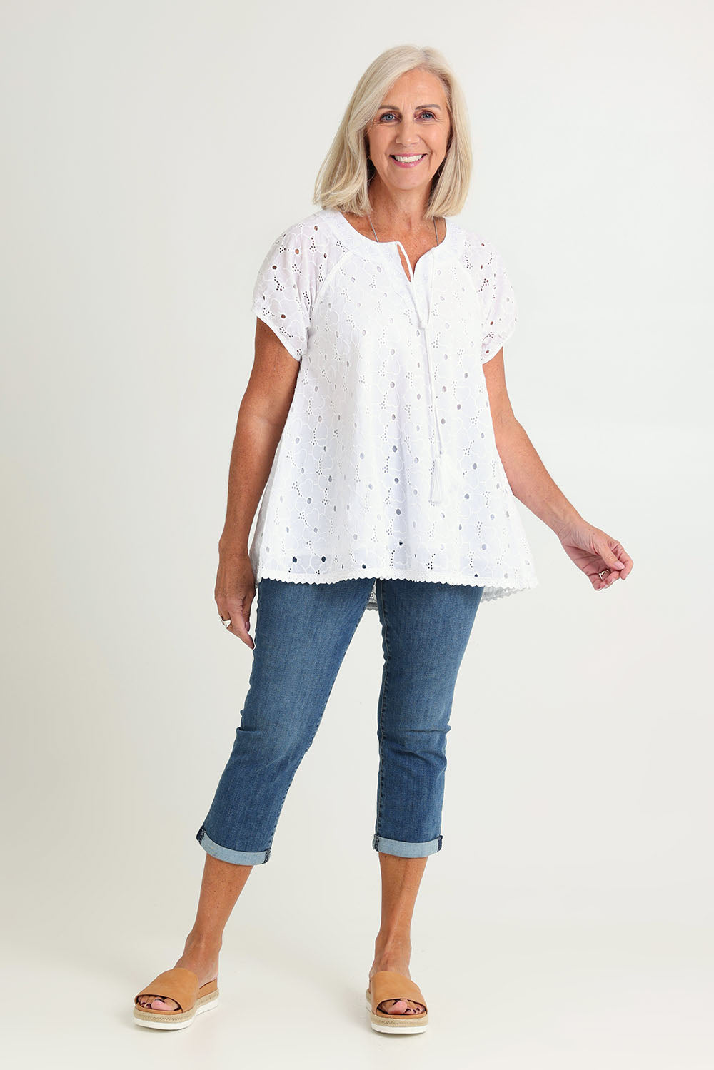 Model Sandy wearing size S of the Sao Paulo Cotton Top in colour Delight (Green), from the front, showing the whole outfit