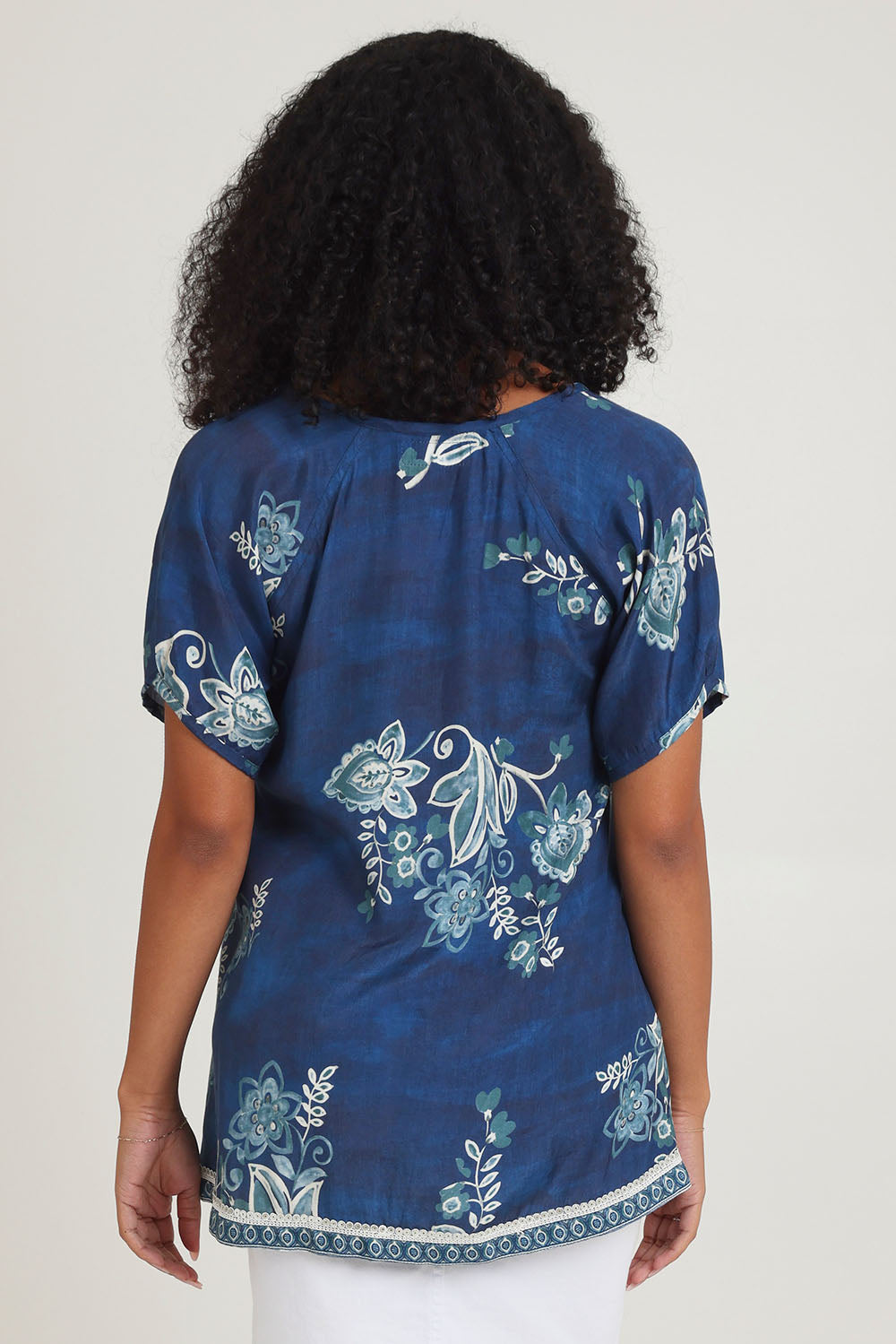 Model Ziara wearing size S of the Sao Paulo Top in colour Selene (Blue), from the back