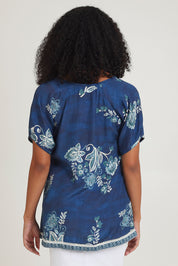 Model Ziara wearing size S of the Sao Paulo Top in colour Selene (Blue), from the back