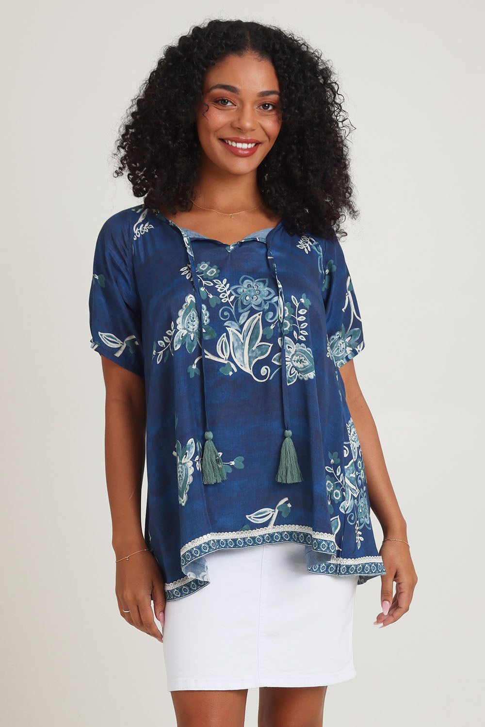 Model Ziara wearing size S of the Sao Paulo Top in colour Selene (Blue), from the front, cropped image