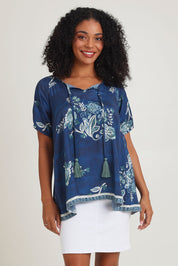 Model Ziara wearing size S of the Sao Paulo Top in colour Selene (Blue), from the front, cropped image