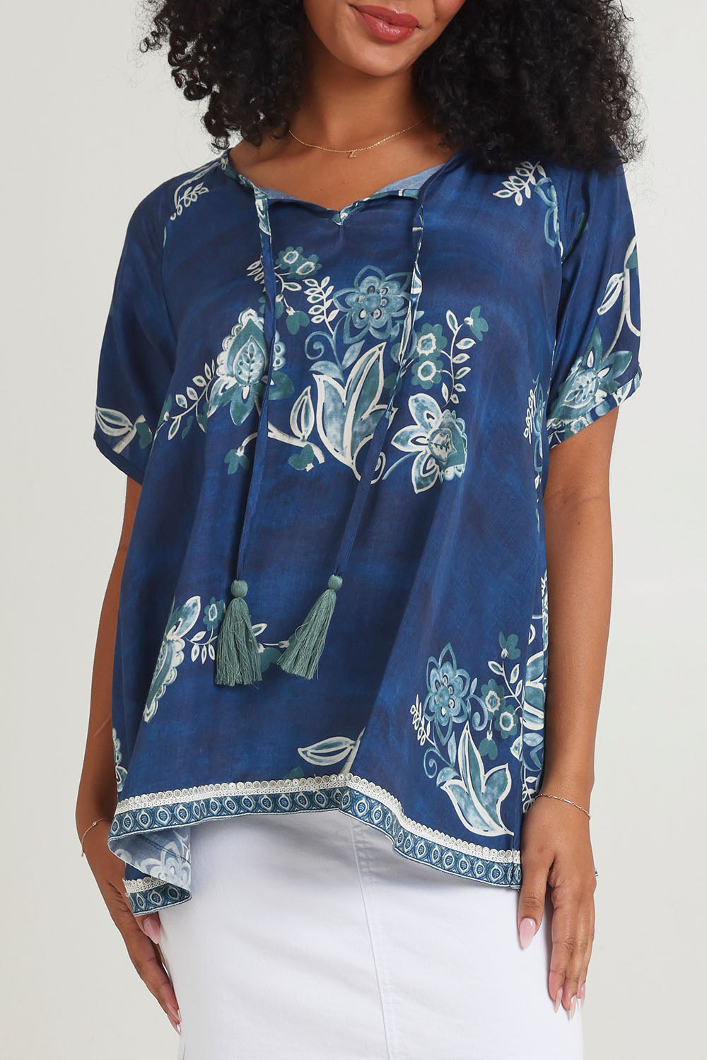 Model Ziara wearing size S of the Sao Paulo Top in colour Selene (Blue), from the front, cropped image