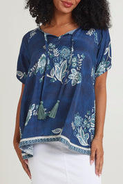 Model Ziara wearing size S of the Sao Paulo Top in colour Selene (Blue), from the front, cropped image