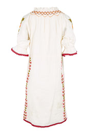 Product shot of the Spell Cotton Dress – Acacia in colour Acacia, from the back