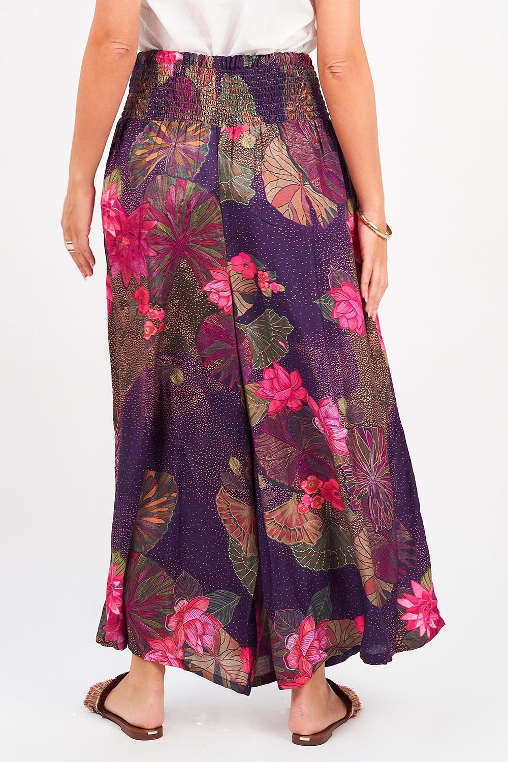 A model wearing the Hendrix Pant in colour Waterlily (Blue), from the back