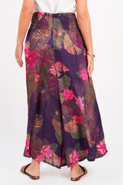 A model wearing the Hendrix Pant in colour Waterlily (Blue), from the back